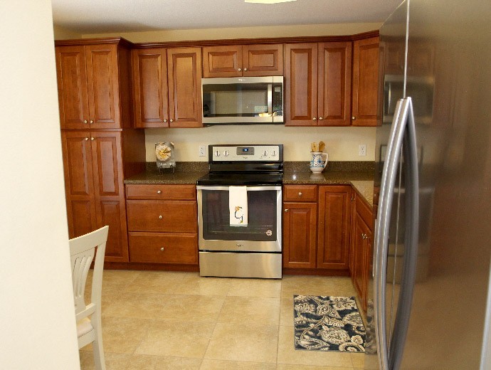 Beautifully updated stainless steel kitchen available in the Gables apartments at Good Samaritan Society - Kissimmee Village in Kissimmee, Florida.