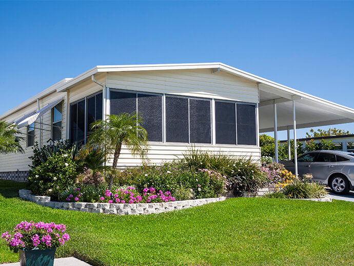 Beautiful exterior of one of the many Manufactured Home neighborhoods available at Good Samaritan Society - Kissimmee Village in Kissimmee, Florida.