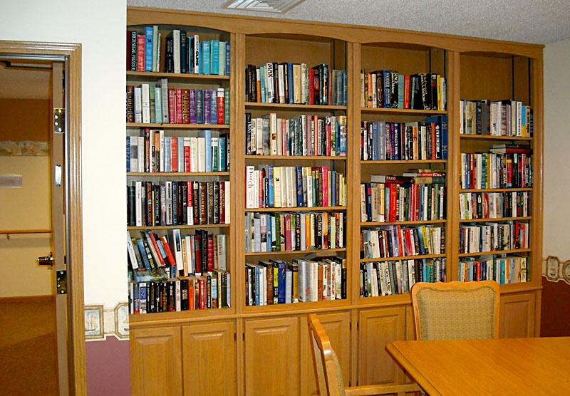 The library is a place to curl up with a book in a large comfy chair at Good Samaritan Society - Heritage Landing in Milford, Iowa.