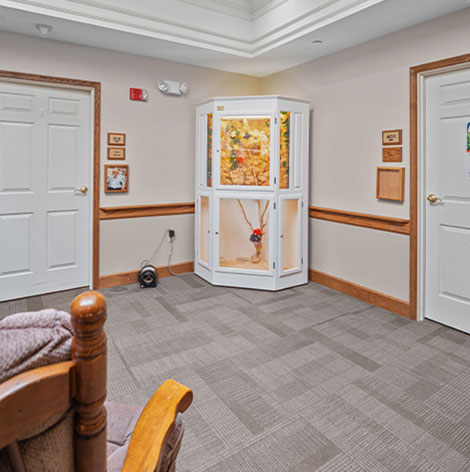 Take a seat and enjoy the aviary in the memory care unit at Good Samaritan Society - Prairie View Gardens in Kearney, Nebraska.