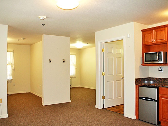 Spacious two-bedroom assisted living apartment with kitchenette at Good Samaritan Society - Willow Wind in Prescott, Arizona