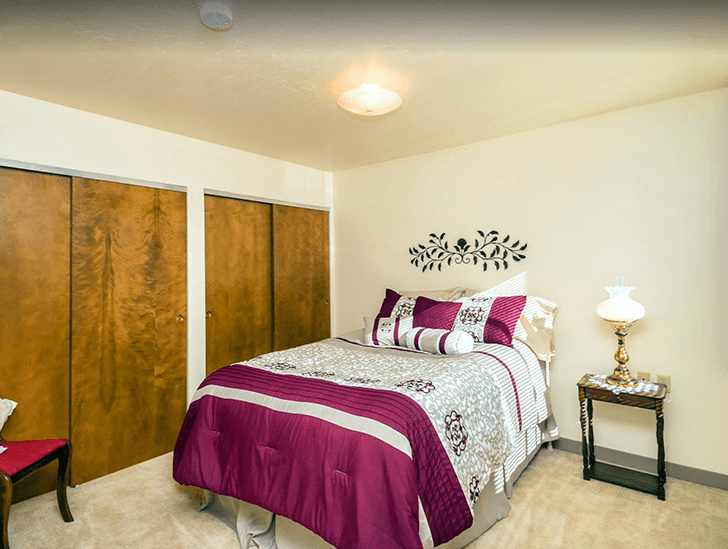 Spacious bedroom with two closets and natural light at Good Samaritan Society - Prescott Village apartment building in Prescott, Arizona.