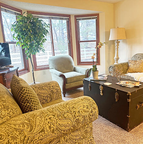 Assisted living apartment living room at Good Samaritan Society - Heritage Place of Roseville.