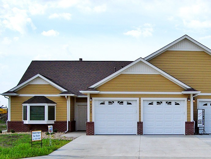 Exterior view of the independent living twin homes with attached garage available at Good Samaritan Society - Prairie Creek Village in Sioux Falls, South Dakota.