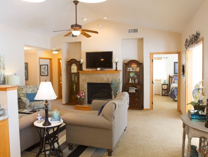 Open concept twin home living room with vaulted ceilings at Good Samaritan Society - Prairie Creek Village in Sioux Falls, South Dakota.