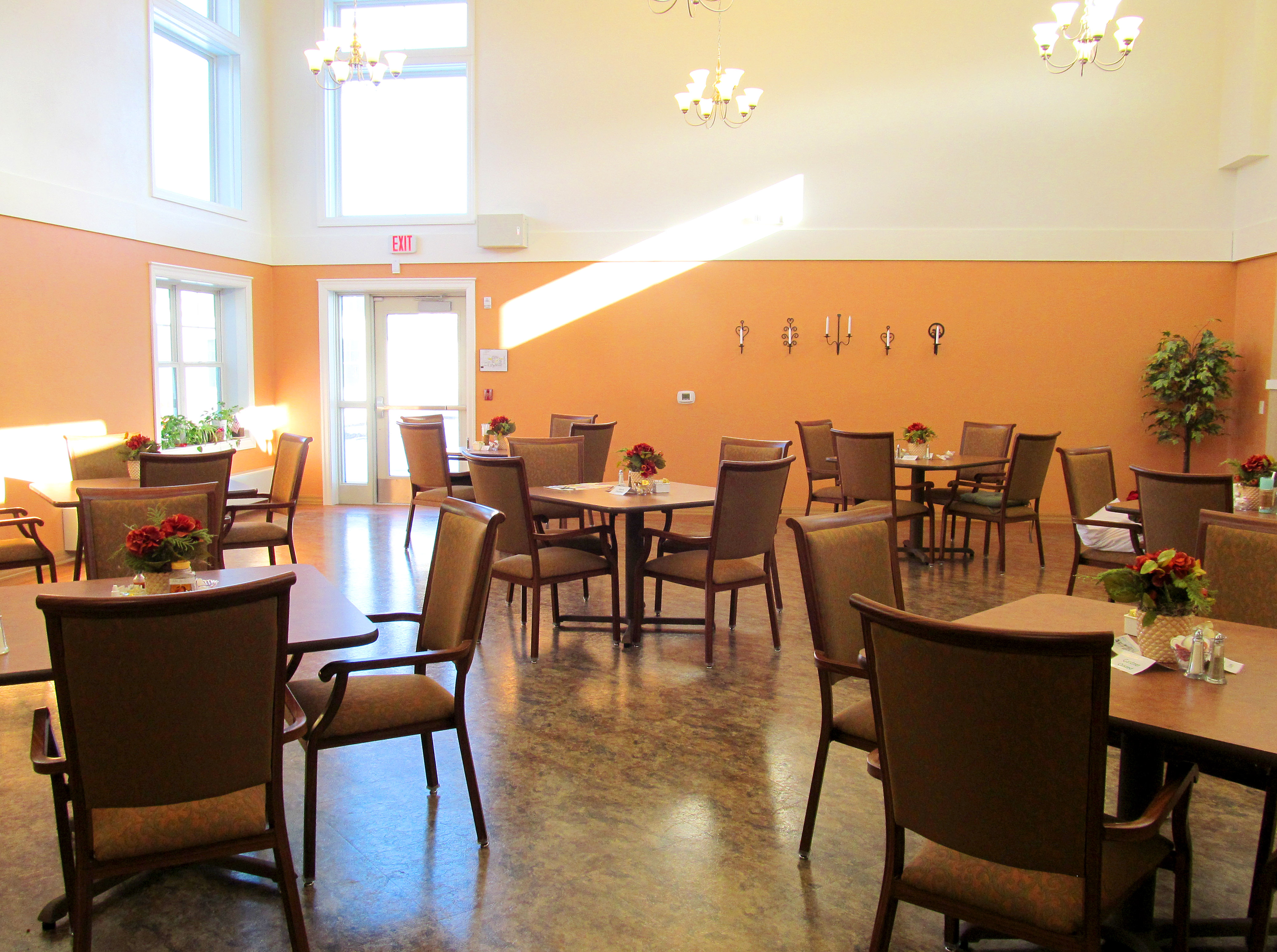 Community dining room for assisted living residents to gather and enjoy a meal with friends at Good Samaritan Society - Scandia Village in Sister Bay, Wisconsin.