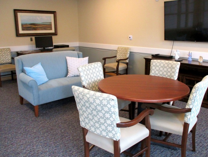 Comfortable seating area in the sunroom for residents and families to enjoy each other's company at Good Samaritan Society - Scandia Village in Sister Bay, Wisconsin.