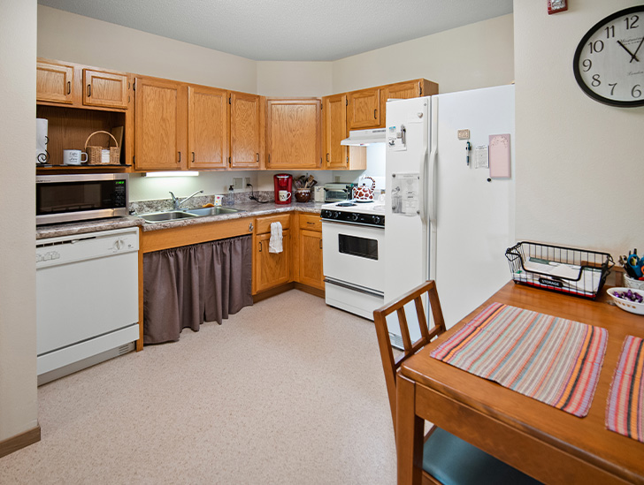 Independent living apartments feature full size kitchens with space for a dining room table at Good Samaritan Society - St. James in St. James, Minnesota.