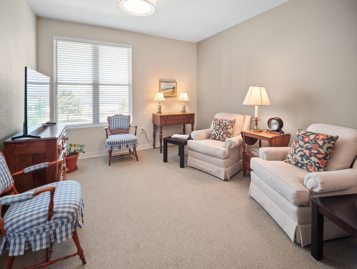 Assisted living apartment living room at Good Samaritan Society - Water Valley Senior Living Resort
