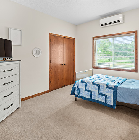 Enjoy natural light and extra space in the assisted living apartment bedrooms at The Lodge of Winthrop in Winthrop, Minnesota.