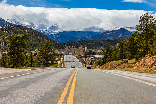 Road in Colorado with mountains in the background