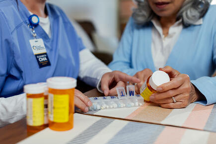 Provider and patient looking at prescription