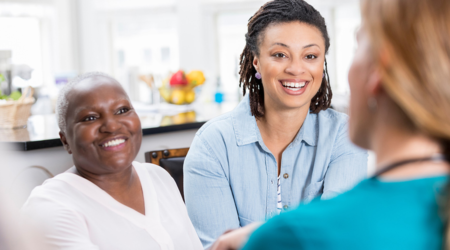 Caregivers and provider talking.