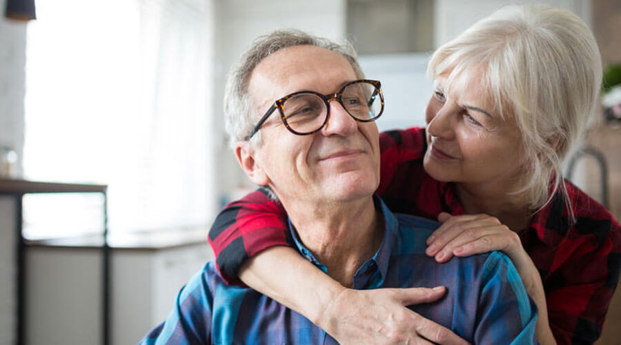 Woman embracing man
