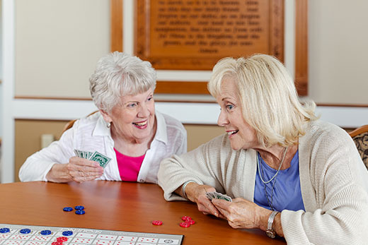 Two women playing a card game.
