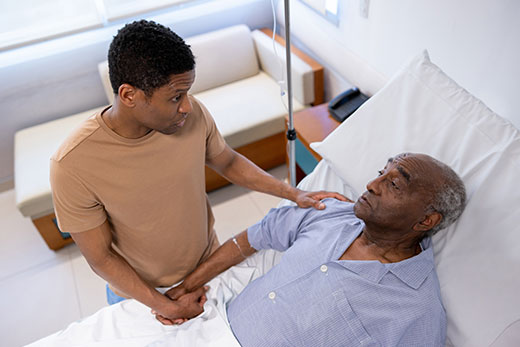 Family member visiting a loved one in hospice.