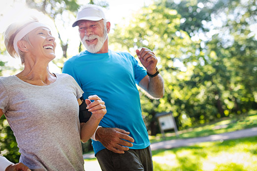 Retired senior couple enjoying a walk outside.