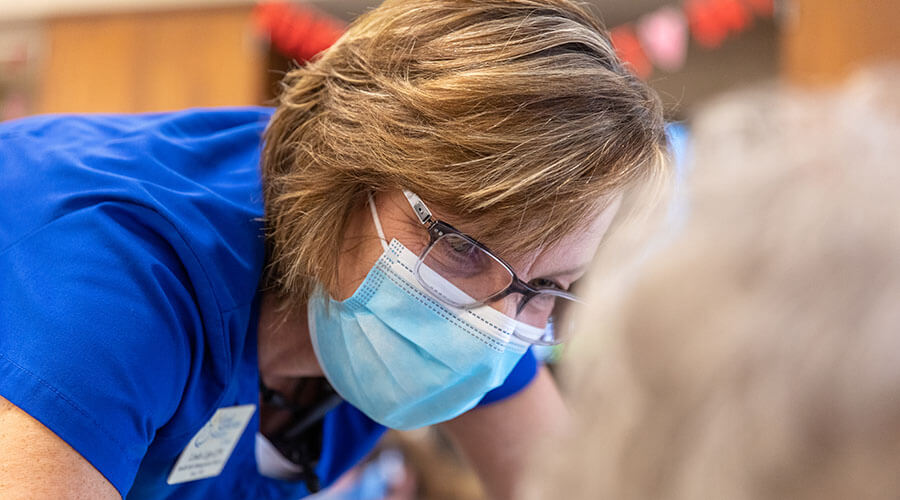 Nurse wearing a mask.