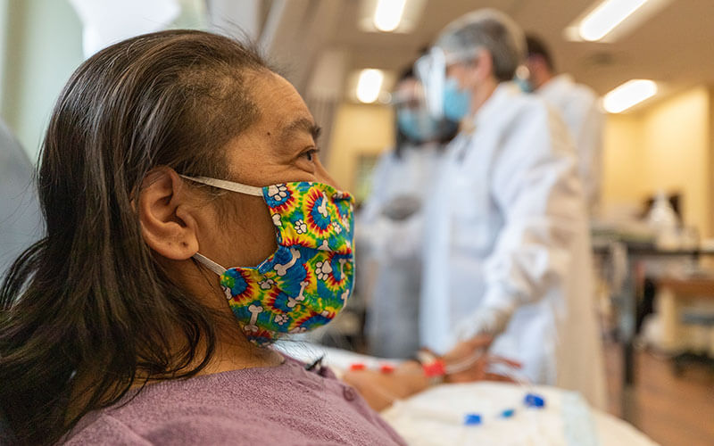 Woman wearing a mask.
