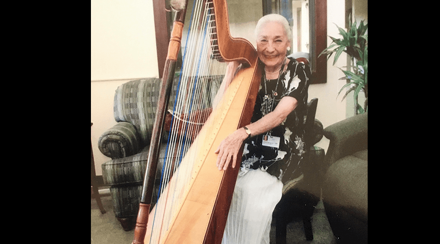 87-year-old harpist plays for patients in hospice