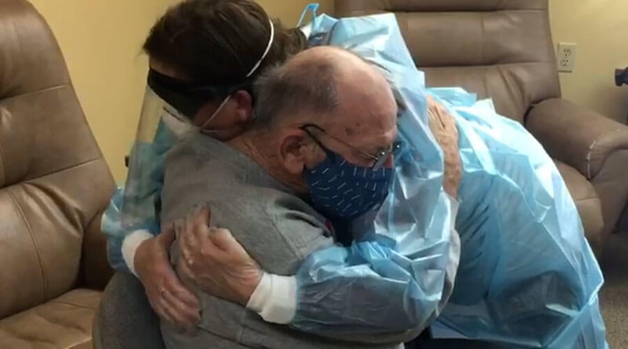 Nurse hugging a patient.
