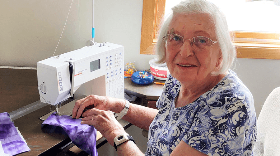 Elna Barton with her sewing machine