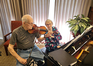 96-year-old newlyweds Carl and Doris Kruse enjoy playing music together.