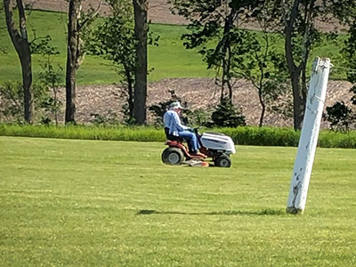 June Reed mowing the farm.