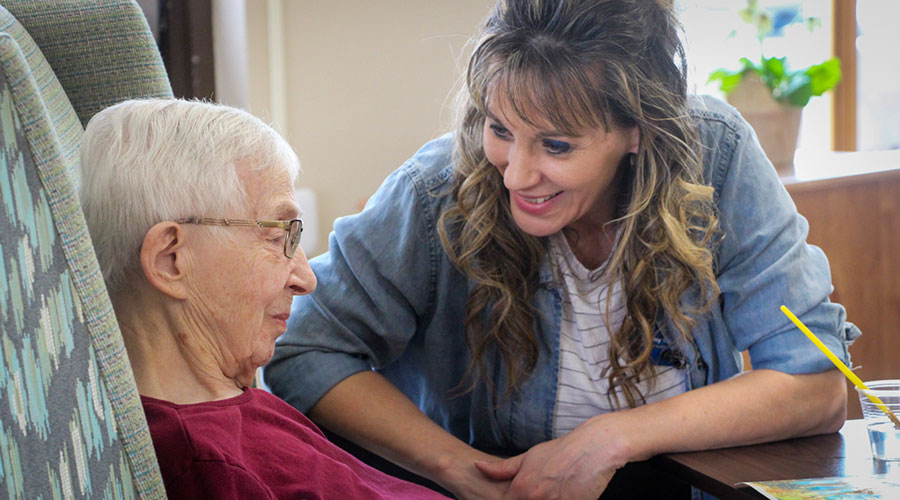 Kammy Ellwanger, Good Samaritan – Wagner director of nursing, talks with resident Dorothea "Dot" Tesch.