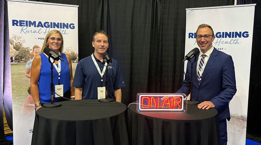 Matt Holsen with Sanford Health News, Fred Pitzl, administrator for the Good Samaritan Society in Olathe, Kansas, and Angela Prevo, a nursing director for the Society in Ottumwa, Iowa.