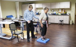 Physical therapist Troy Grassel works with Dianne Karlstad