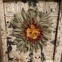 Joyce uses dried flowers and grasses to make framed artwork.