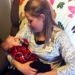 Home health RN case manager LaToya Buzalsky holds baby Murphy.