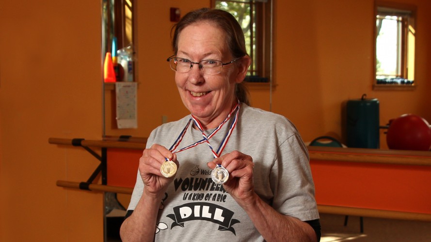 Sharon Holding Two Medals