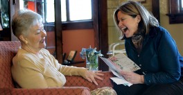 Senior woman talks with a Good Samaritan Society memory care assisted living employee