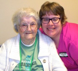 Certified nursing assistant Stephanie Judy (right) loves her residents, including Hazel Moyers (left).